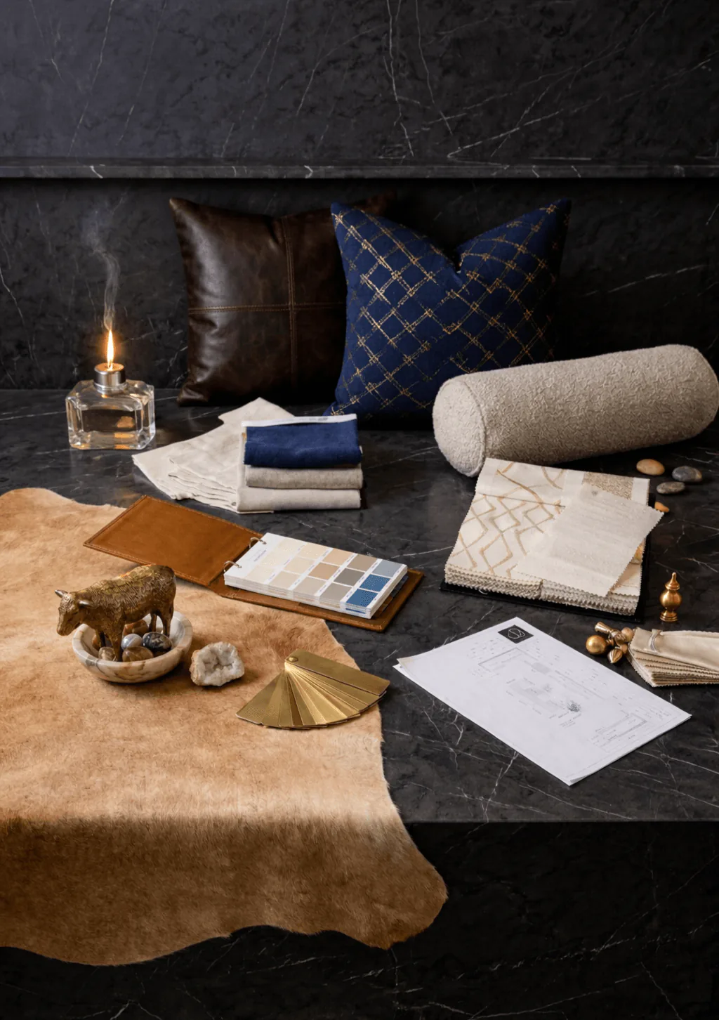 Layered textile and decor inspiration with fabrics, trim, and finish samples