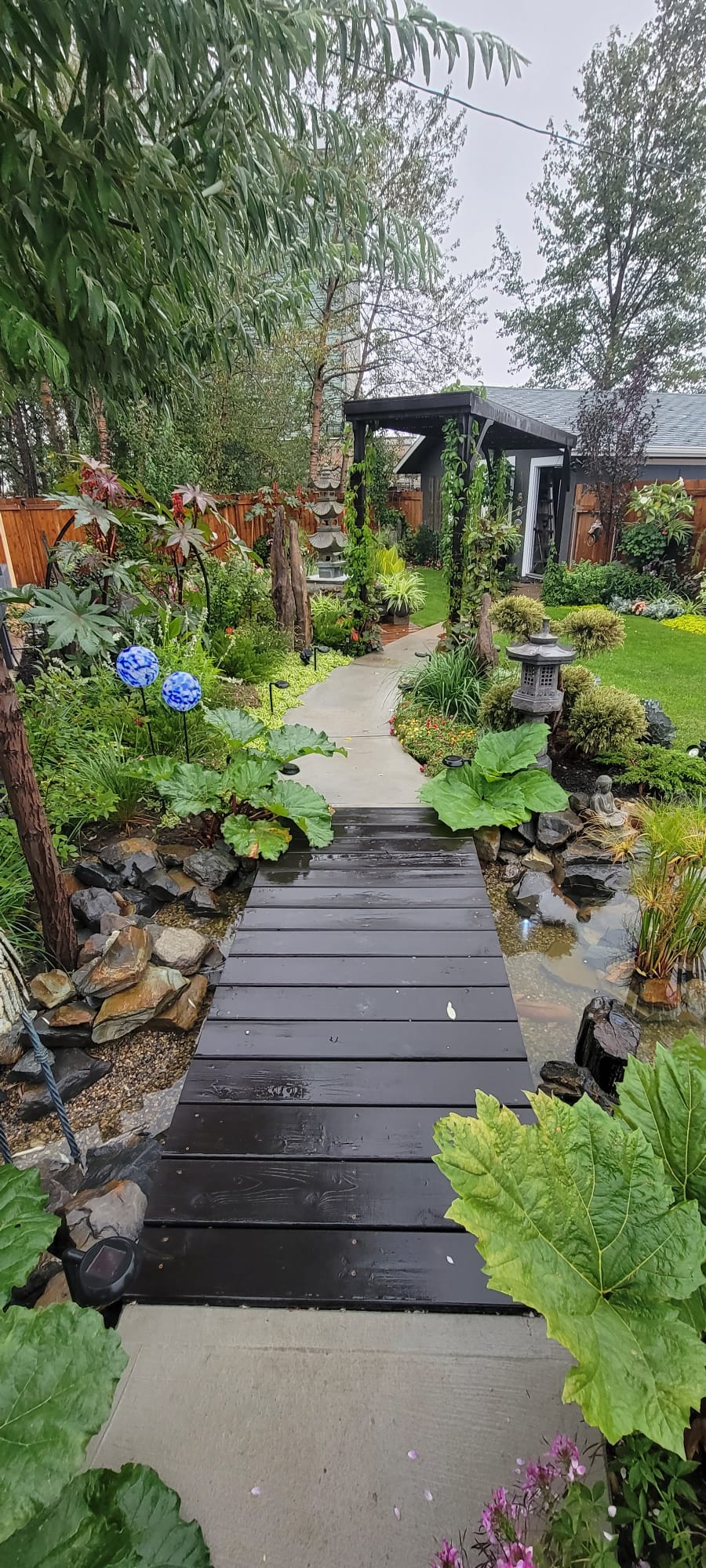 Backyard oasis bridge concept by Interiors on Main